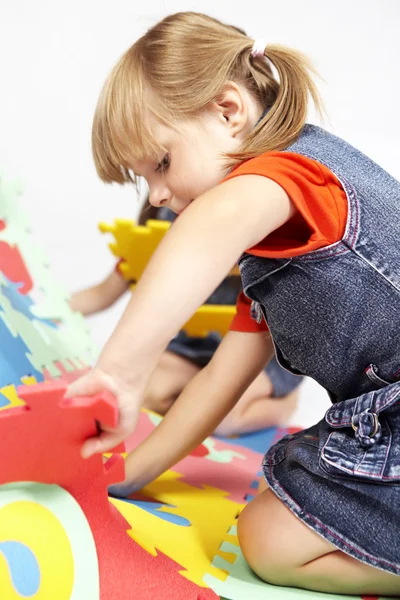 Children at play with color foam toys — Stock Photo, Image