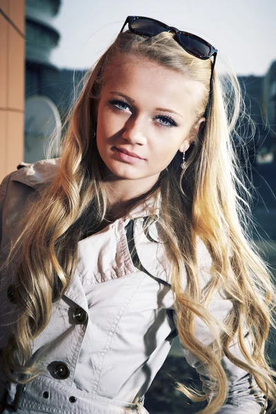 Young blonde beautiful lady on city stairs posing for beauty shots — Stock Photo, Image