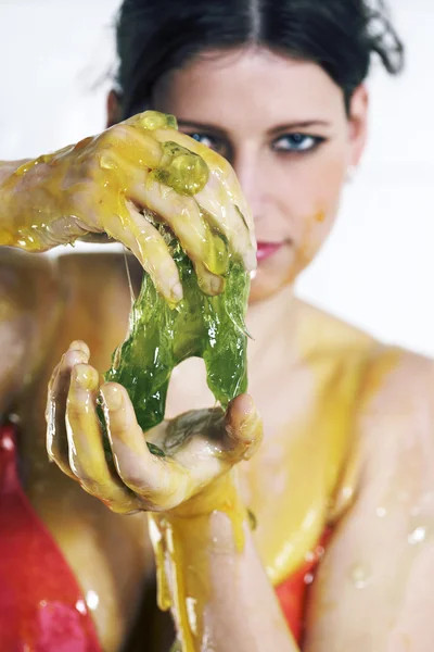 Young woman playing with melted Jelly — Stock Photo, Image