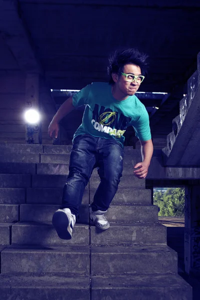 Young Asian boy posingfor stylish photos in ruins of building — Stock Photo, Image