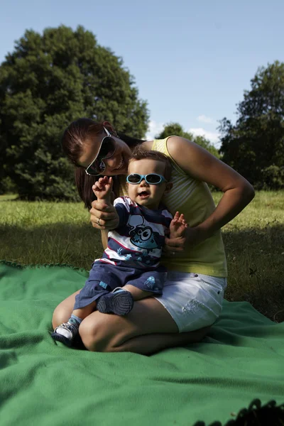 Mother and her son in summer park — Stock Photo, Image