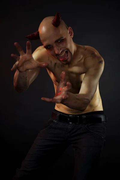 Man posing in styling of devil — Stock Photo, Image