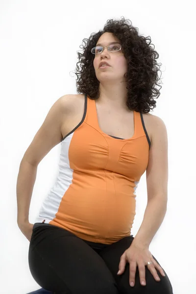 Pregnant young woman excercising yoga — Stock Photo, Image