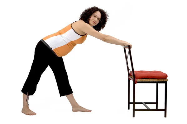 Pregnant young woman excercising yoga balance — Stock Photo, Image