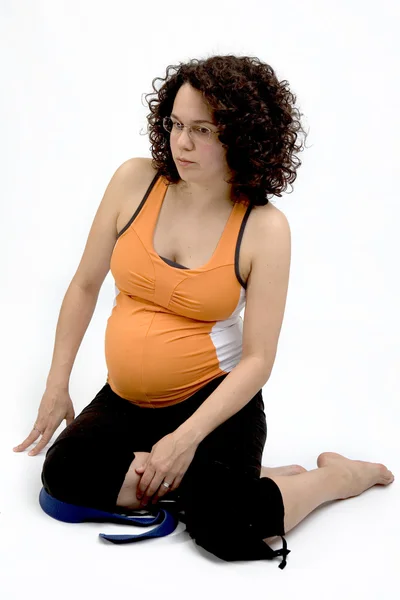 Pregnant young woman excercising yoga balance — Stock Photo, Image