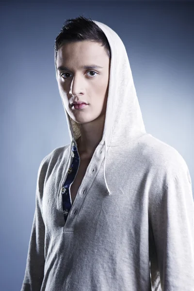 Young man in hood — Stock Photo, Image