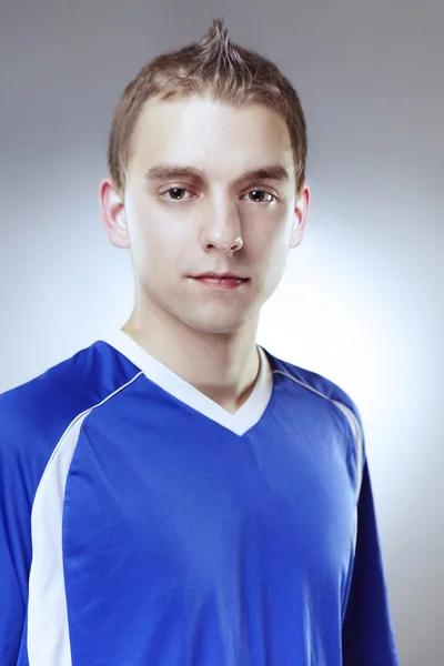 Soccer player in studio — Stock Photo, Image