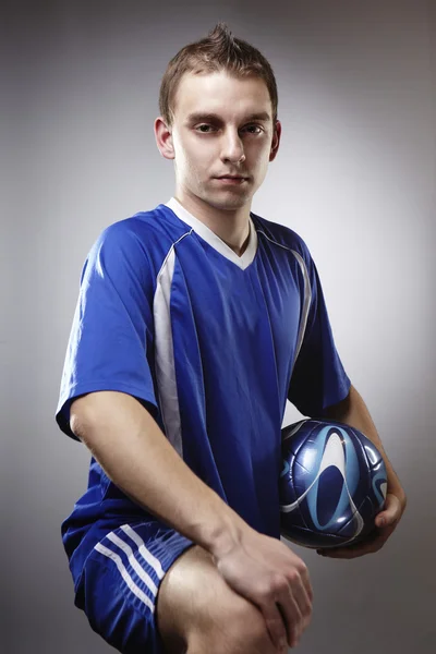 Soccer player in studio — Stock Photo, Image