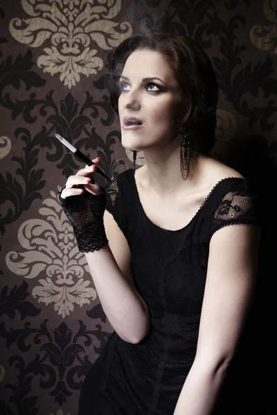 Nice lady model posing as a cigarette smoker — Stock Photo, Image