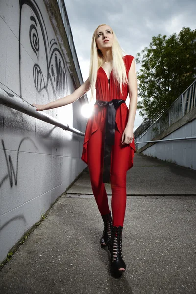 Blonde girl in a red dress — Stock Photo, Image