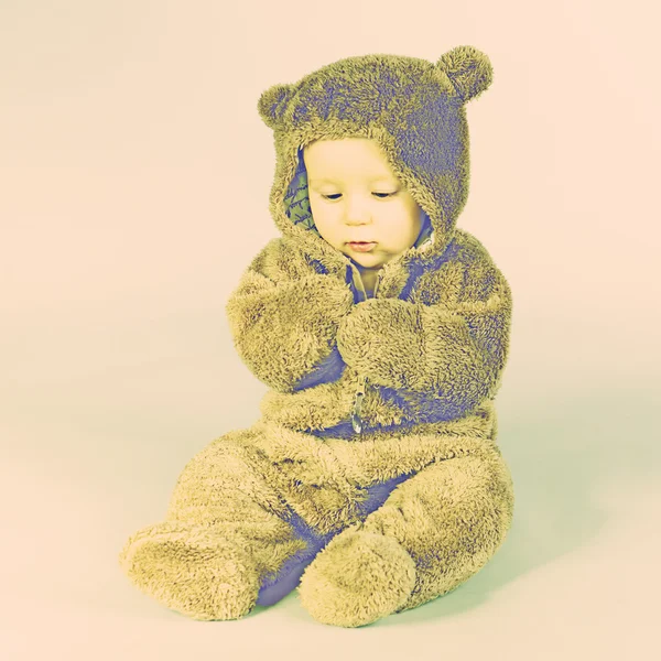 Kid in a bear suit — Stock Photo, Image