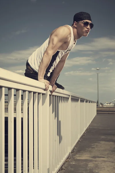 Man posing on the bridge — Stock Photo, Image