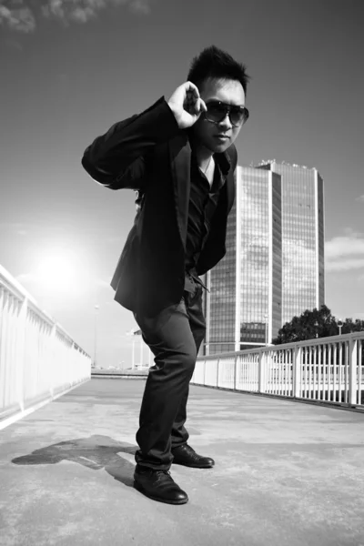 Asian man posing on the bridge — Stock Photo, Image