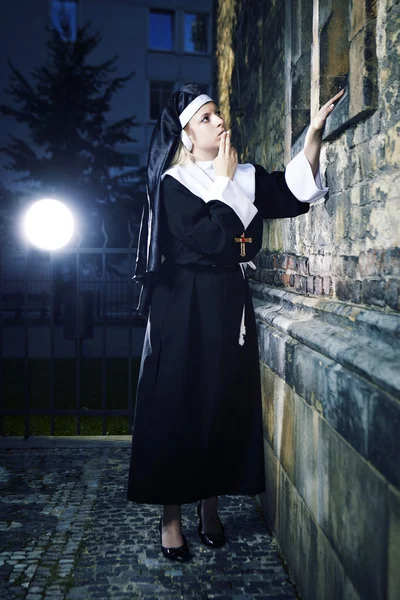 Nun looking to church — Stock Photo, Image