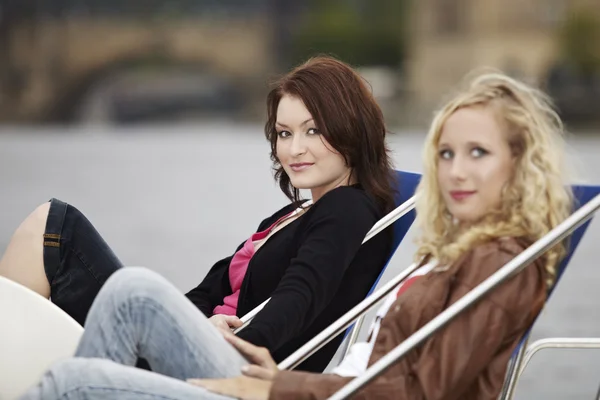 Two friends relaxing on river — Stock Photo, Image