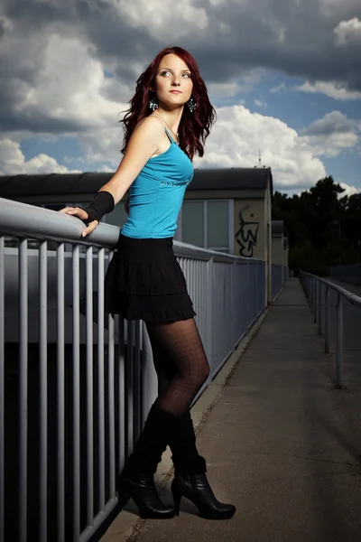 Girl posing in summer light on floodgate — Stock Photo, Image