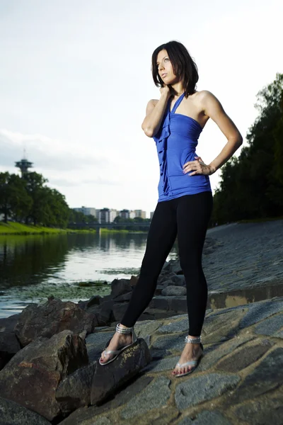 Slim lady by the river — Stock Photo, Image
