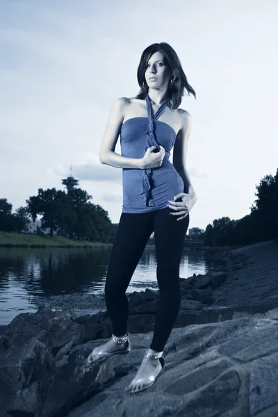 Slim lady by the river — Stock Photo, Image