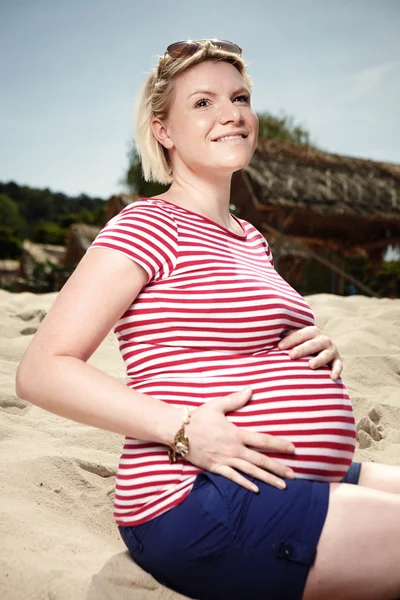 Pregnant beauty in red shirt — Stock Photo, Image