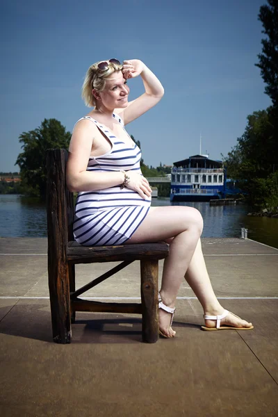 Nice pregnant lady by the river — Stock Photo, Image