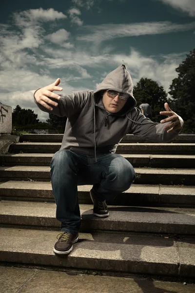 Gesturing man in hood — Stock Photo, Image