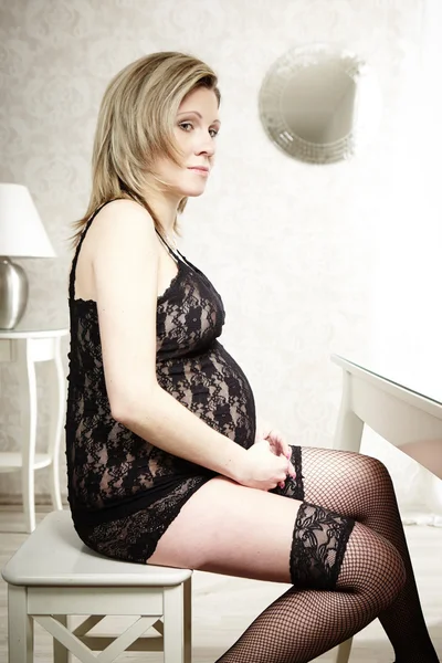 Nice pregnant lady in bedroom — Stock Photo, Image
