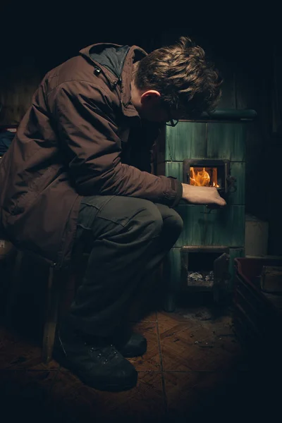 Adult Man Winter Time Drowning Tiled Stove — Foto de Stock