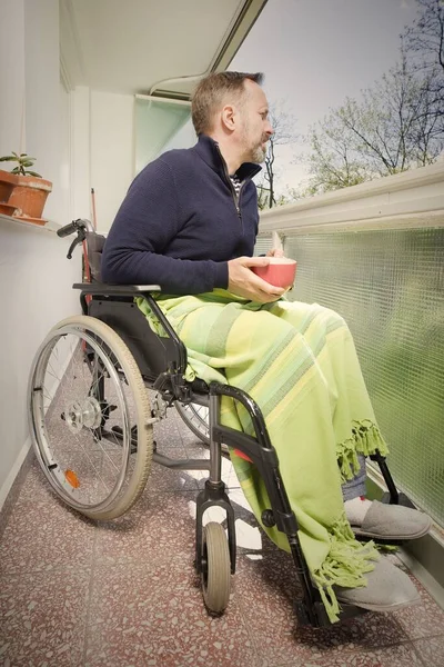 Disabled Man Wheel Chair Enjoying Nice Day Balcony — 图库照片