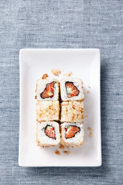 Sushi rolls with rice, fish and seaweed