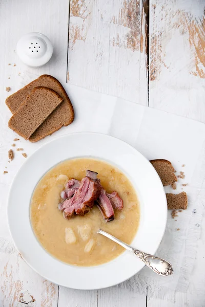 Pea soup with bread and smoked ribs — Stock Image Pea soup with bread and smoked ribs Stock Photo