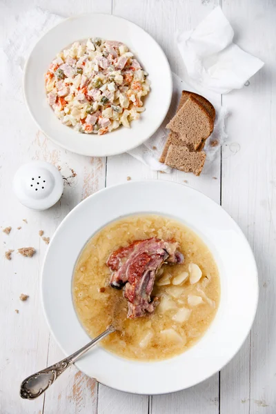 Russian traditional salad olivier and Pea soup with bread and sm — Stock Image Russian traditional salad olivier and Pea soup with bread and sm Stock Picture