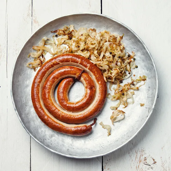Roasted sausage with stewed cabbage — Stock Image Roasted sausage with stewed cabbage Stock Image