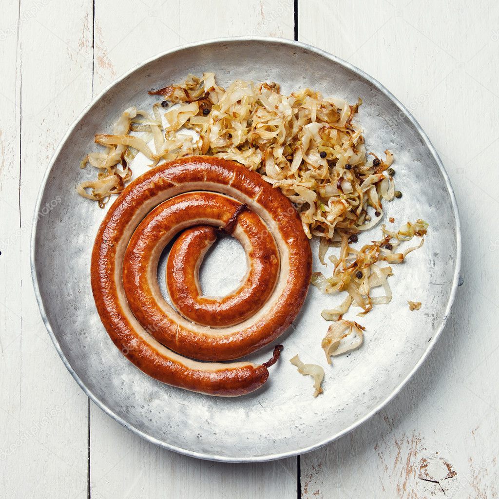 Roasted sausage with stewed cabbage Stock Photo by ©lisovskaya 24483169