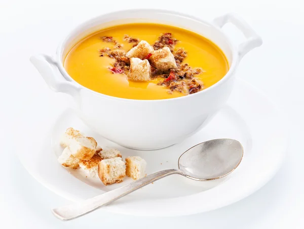 Pumpkin soup with croutons on white background — Stock Image Pumpkin soup with croutons on white background Royalty Free Stock Images