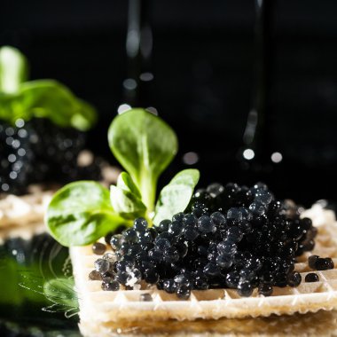 Snack with black caviar