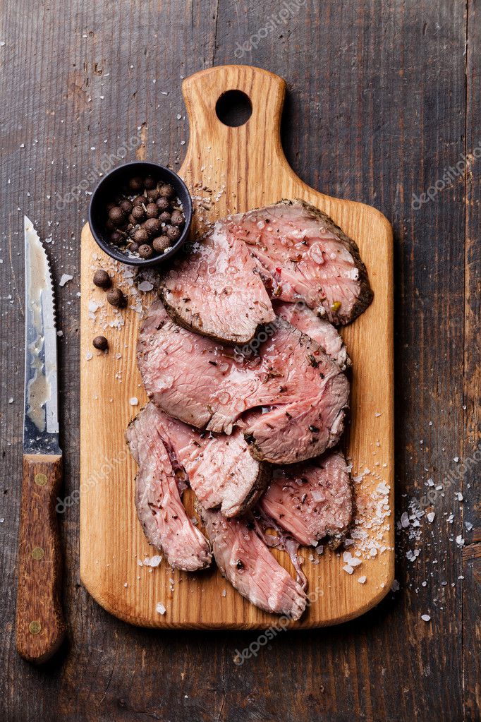 Roast beef on cutting board — Stock Photo © lisovskaya 38573191