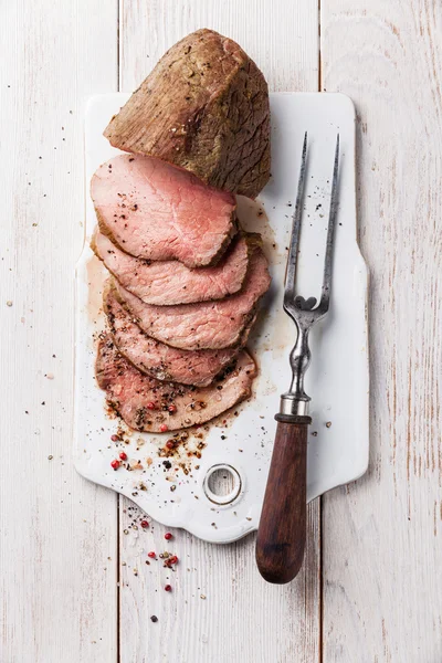 Roast beef and meat fork