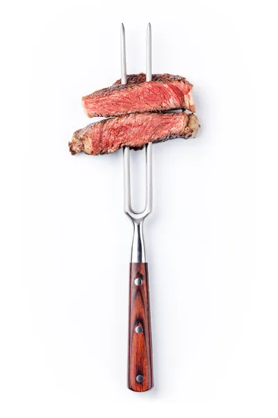 Beef steak on meat fork