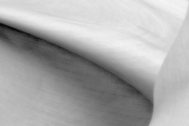 Pürüzsüz siyah ipek kumaş ya da saten lüks kumaş dokusu düğün arka planı olarak kullanılabilir. Lüks ve soyut arzu için kumaşlar.