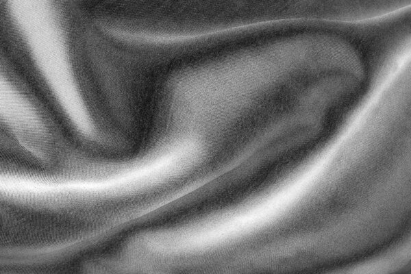 Гладкая элегантная черная шелковая ткань или атласная текстура роскошной ткани может использоваться в качестве свадебного фона. для драпировки роскошных абстрактных десиг