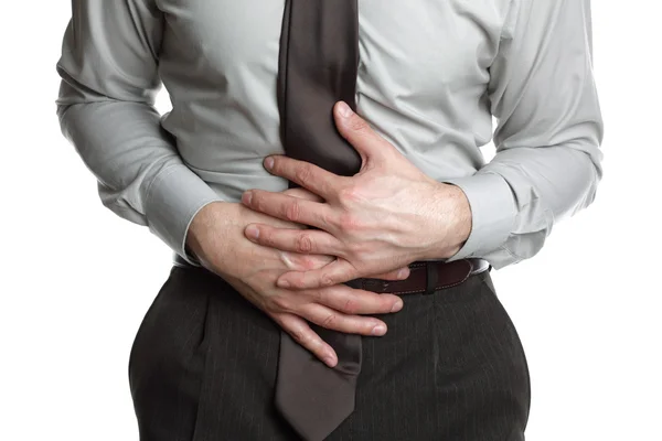 Biznesmen z bólem brzucha — Zdjęcie stockowe