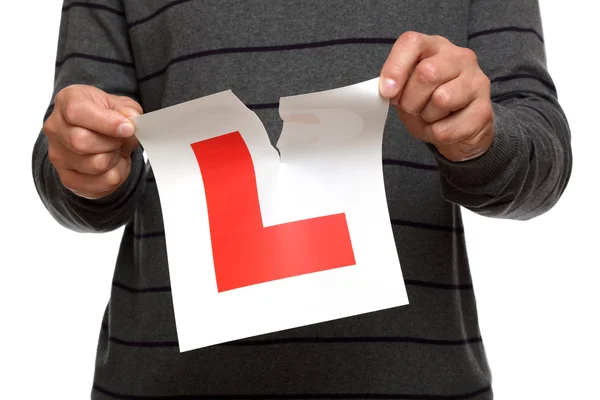 Tearing up L plate after passing driving test — Stock Photo, Image