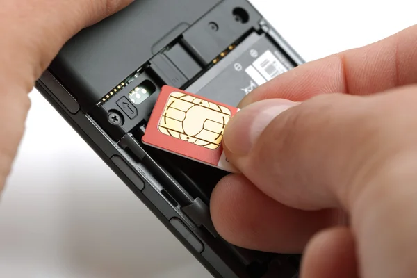 Inserting a sim card — Zdjęcie stockowe