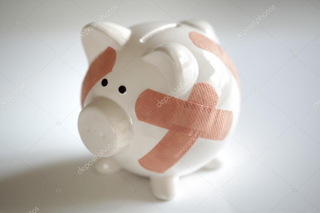 Piggy bank with band aids