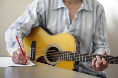Song writing with acoustic guitar clipart