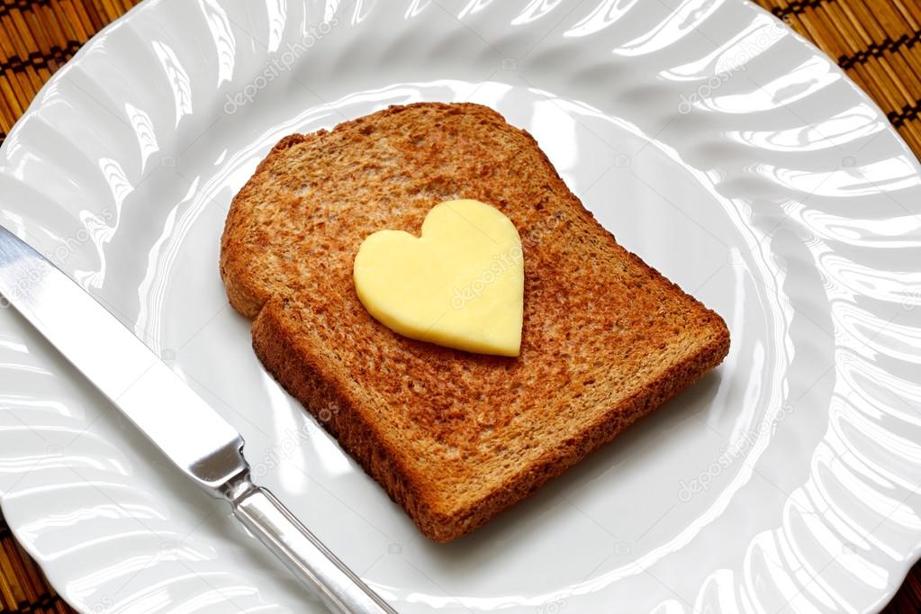 Heart shaped butter on toast