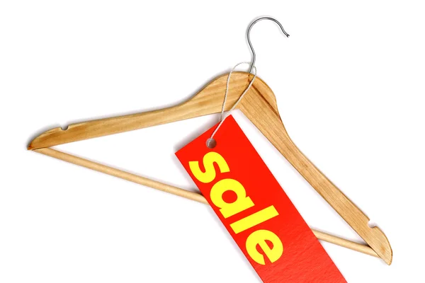 Wooden coat hanger with sale label — Stock Photo, Image