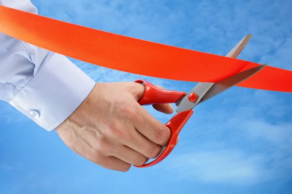 Cutting a red ribbon — Stock Photo, Image