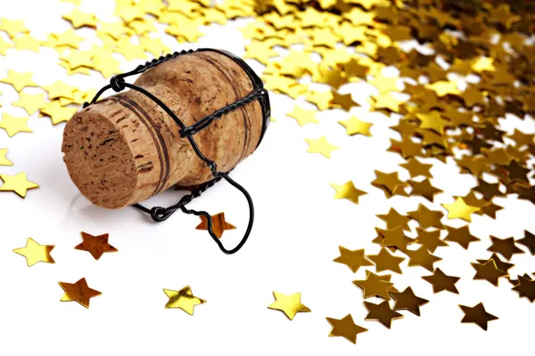 Confetti and champagne cork — Stock Photo, Image