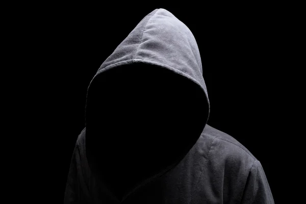 Homem encapuzado na sombra Fotos De Bancos De Imagens Sem Royalties
